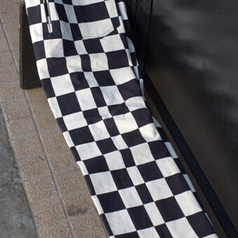 IRREGULAR CHECKERED FLAG STRAIGHT TROUSERS
