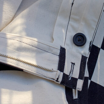 IRREGULAR CHECKERED FLAG STRAIGHT TROUSERS