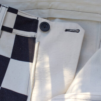 IRREGULAR CHECKERED FLAG STRAIGHT TROUSERS