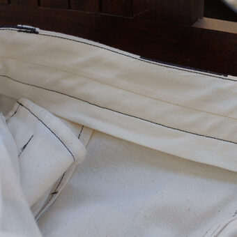 IRREGULAR CHECKERED FLAG STRAIGHT TROUSERS