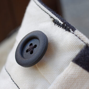 IRREGULAR CHECKERED FLAG STRAIGHT TROUSERS