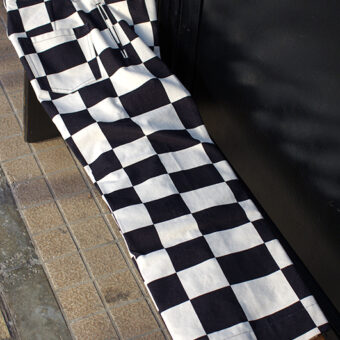 IRREGULAR CHECKERED FLAG WIDE TROUSERS