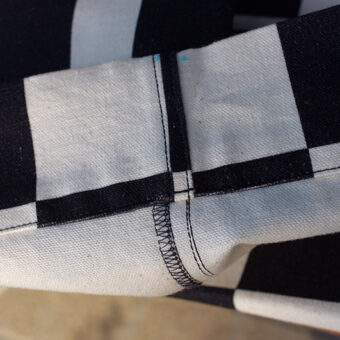 IRREGULAR CHECKERED FLAG WIDE TROUSERS