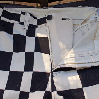 IRREGULAR CHECKERED FLAG WIDE TROUSERS