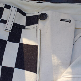 IRREGULAR CHECKERED FLAG WIDE TROUSERS