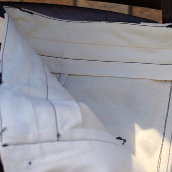 IRREGULAR CHECKERED FLAG WIDE TROUSERS