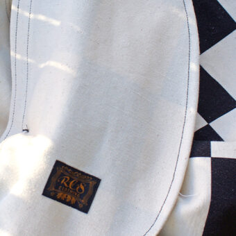 IRREGULAR CHECKERED FLAG WIDE TROUSERS