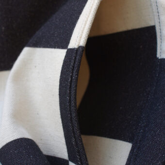 IRREGULAR CHECKERED FLAG WIDE TROUSERS