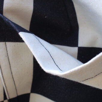 IRREGULAR CHECKERED FLAG WIDE TROUSERS